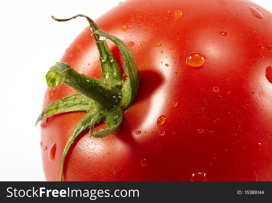 Close-up single tomato with waterdrops, isolated on white. Close-up single tomato with waterdrops, isolated on white.