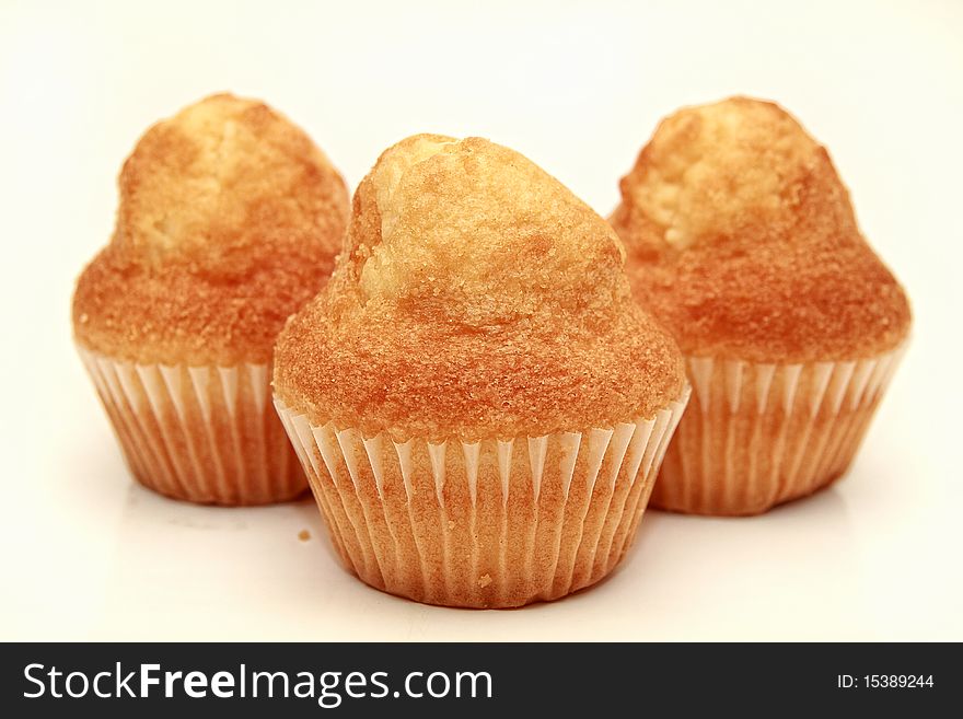 An image of three muffins over white background