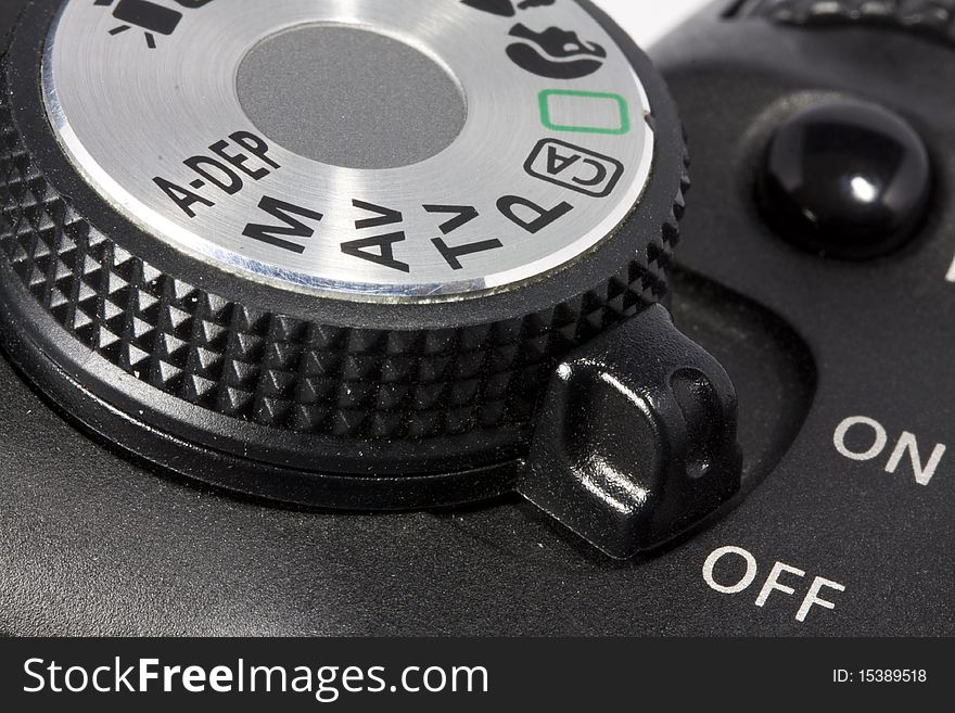 Closeup dial and on/off button on DSLR camera