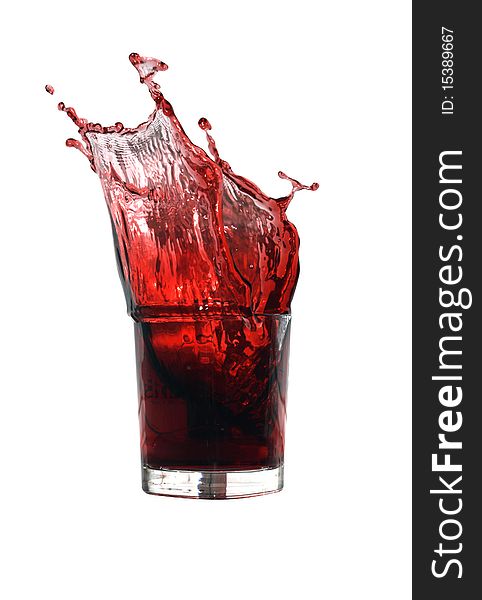 Glass of splashing cherry juice isolated on white background with clipping path