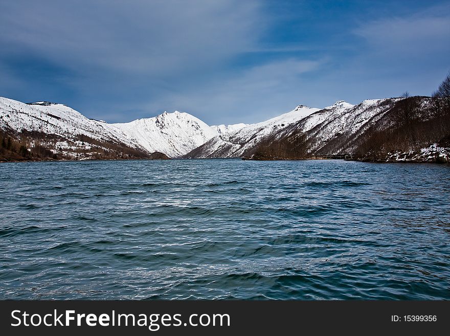 Lake in front of a snowy mountain