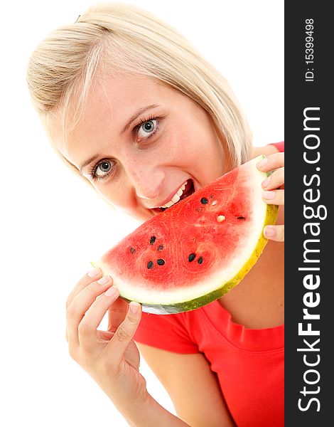 An attractive young girl eating a slice of watermelon. An attractive young girl eating a slice of watermelon