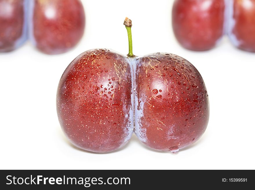 Fresh Ripe Twinned Plums Isolated On White