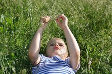 Kid Head Lies On Grass Stock Images