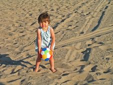 Girl Playing At The Beach Royalty Free Stock Photography Girl Playing At The Beach Royalty Free Stock Photography