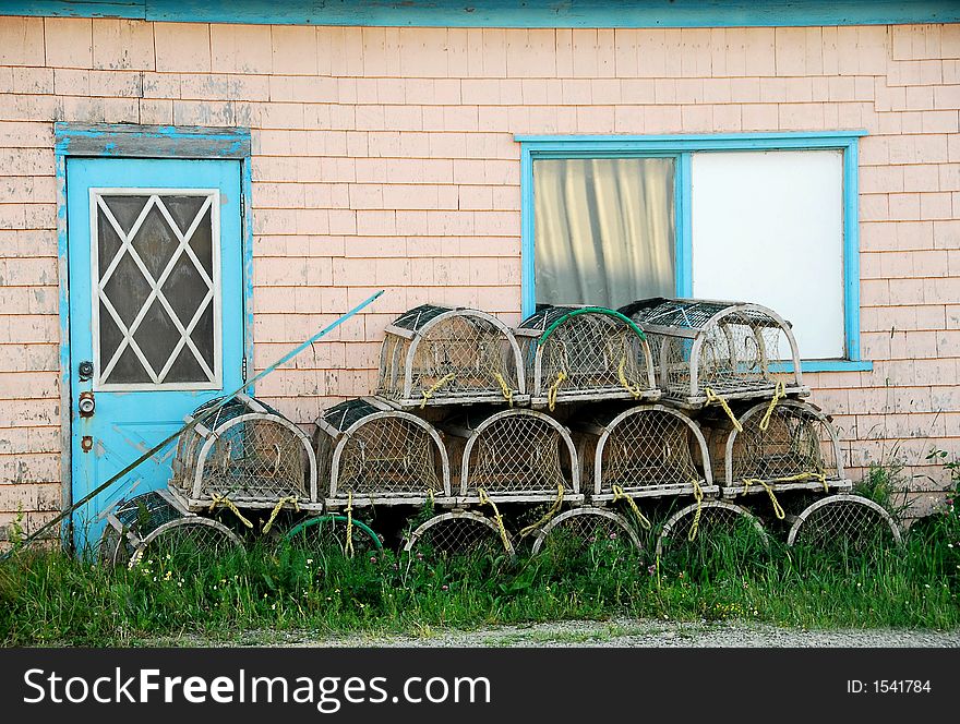 Lobster traps against a colorful shack,

Iles de madeleine, Canada. Lobster traps against a colorful shack,

Iles de madeleine, Canada