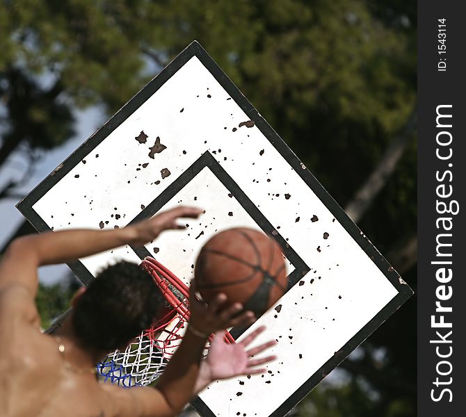 Basketball player shooting over his opponent