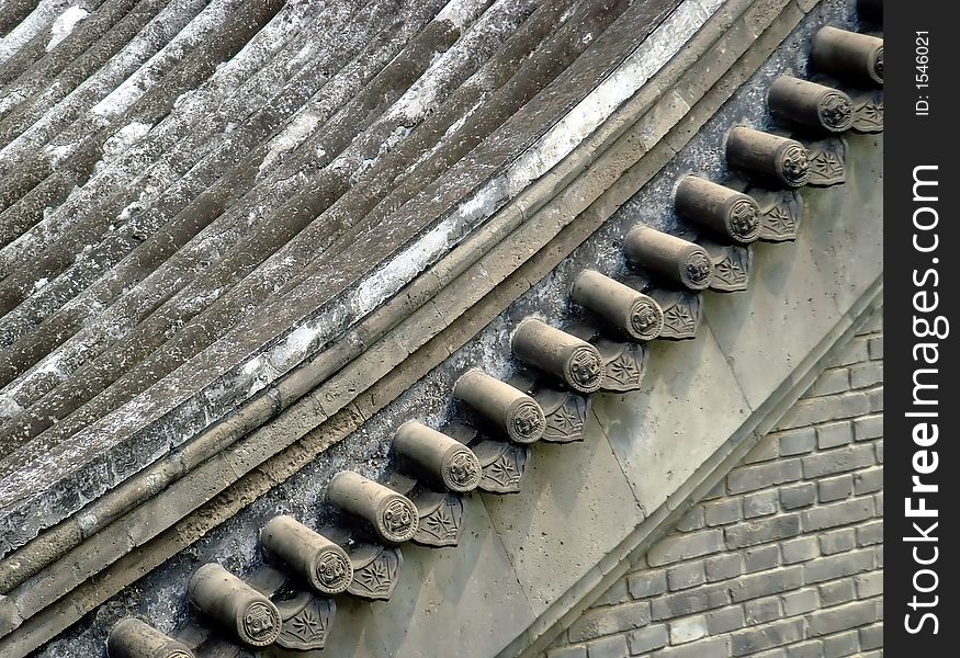 Very amazing eaves of one chinese ancient house in courtyard(siheyuan), the lines and composition of this image are very attractive. Very amazing eaves of one chinese ancient house in courtyard(siheyuan), the lines and composition of this image are very attractive