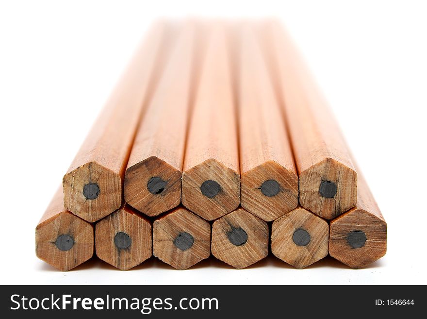 Pile of wooden pencils for plotting on a white background
