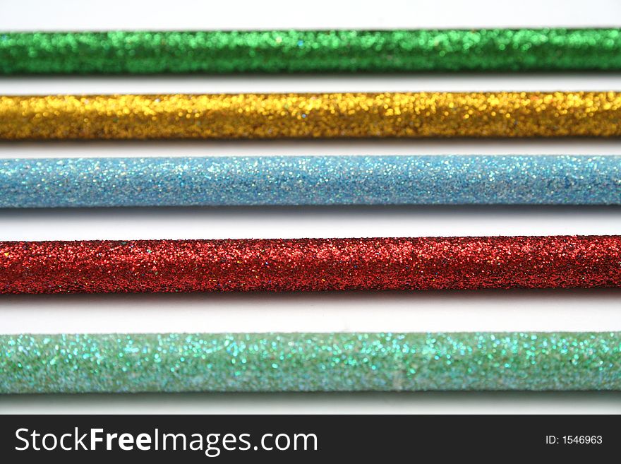 Five Celebratory Color Pencils With A Sparkling Covering Macro