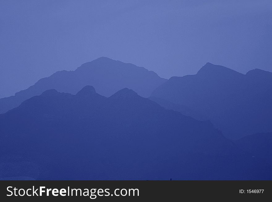Mountain, dusk blue shaded peaks. Mountain, dusk blue shaded peaks