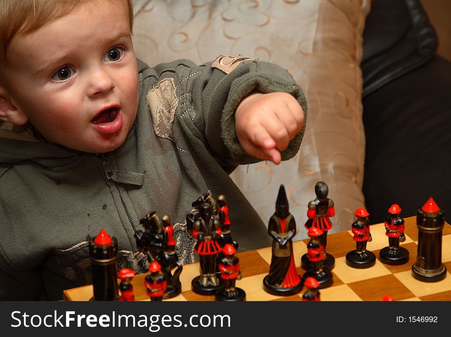 Young boy playing chess