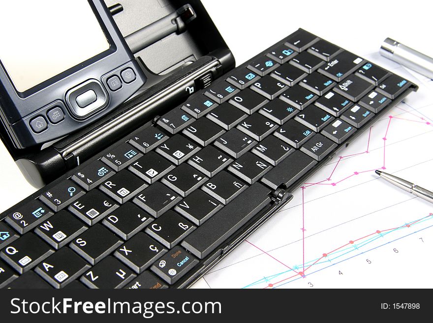 PDA and keyboard with chart on white background