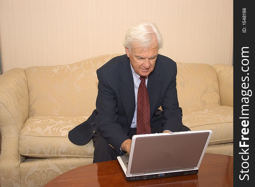 Senior Businessman on a Laptop Computer. Senior Businessman on a Laptop Computer