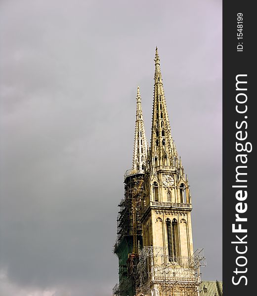 Church towers renovating with cloudy sky