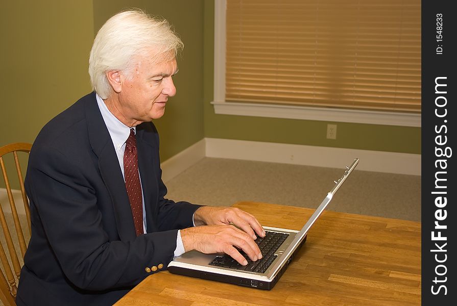 Senior Businessman on a Laptop Computer. Senior Businessman on a Laptop Computer