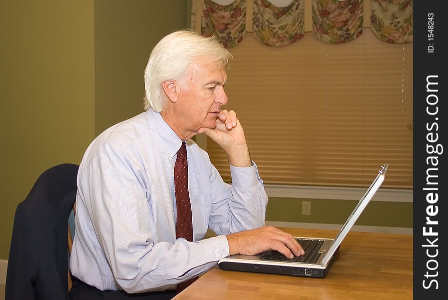 Senior Businessman on a Laptop Computer. Senior Businessman on a Laptop Computer