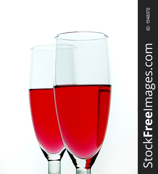 Red wine over white background