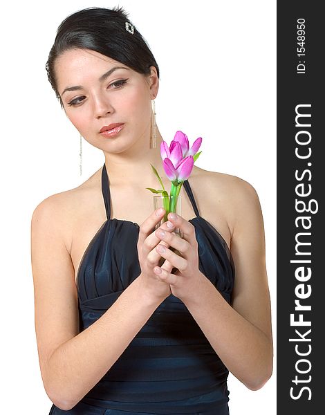 Attractive woman holding flowers in her hands. Attractive woman holding flowers in her hands