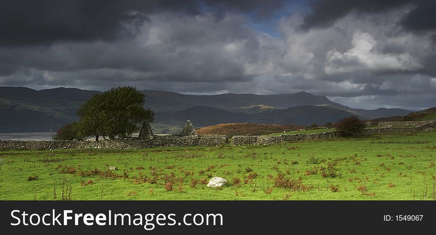 A dry stone dwelling lies abandoned above the Mawddach Estuary in Wales.