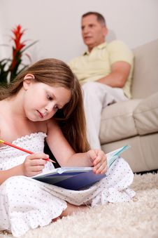 Cute Girl Studying With Her Father Royalty Free Stock Image