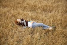Young Beautiful Girl Lying At Yellow Autumn Field. Stock Photos Young Beautiful Girl Lying At Yellow Autumn Field. Stock Photos