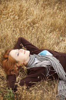 Young Beautiful Girl Lying At Yellow Autumn Field. Royalty Free Stock Image Young Beautiful Girl Lying At Yellow Autumn Field. Royalty Free Stock Image