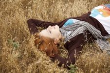 Young Beautiful Girl Lying At Yellow Autumn Field. Royalty Free Stock Photography Young Beautiful Girl Lying At Yellow Autumn Field. Royalty Free Stock Photography