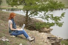Girl With Laptop At Rock Near Lake And Tree. Royalty Free Stock Images Girl With Laptop At Rock Near Lake And Tree. Royalty Free Stock Images
