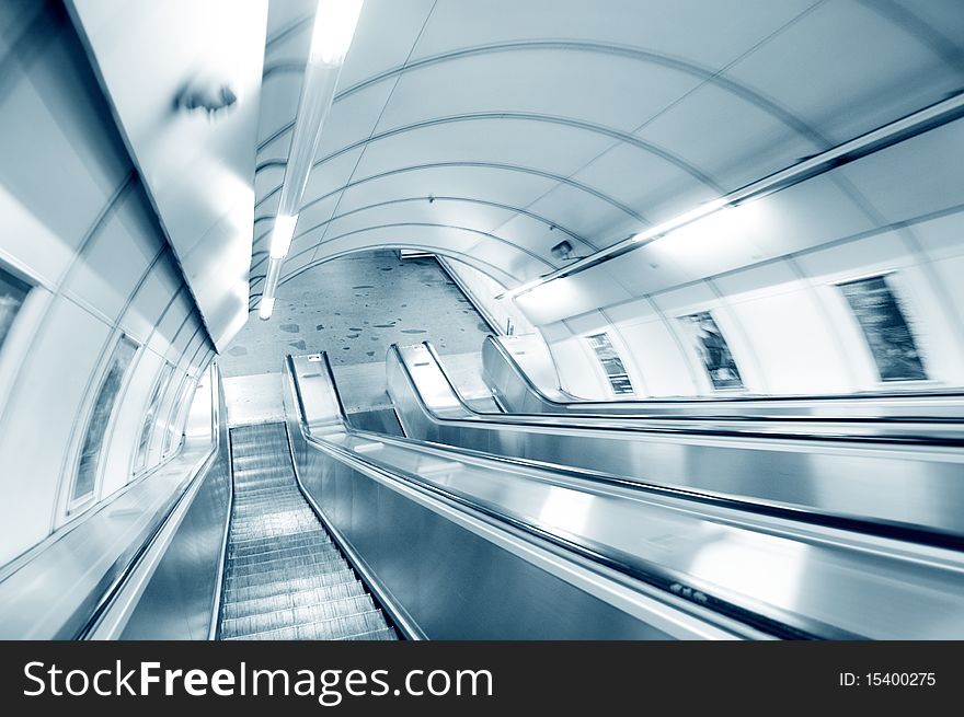 Escalator in subway. Abstract motion picture.