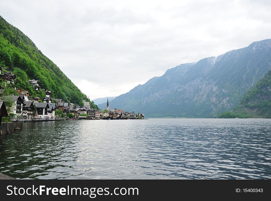 Hallstatt is an old fishing village,an UNESCO world heritage site, situated near the Alps along the lake.  This is an overview of the village along the water on the hillside. Hallstatt is an old fishing village,an UNESCO world heritage site, situated near the Alps along the lake.  This is an overview of the village along the water on the hillside.