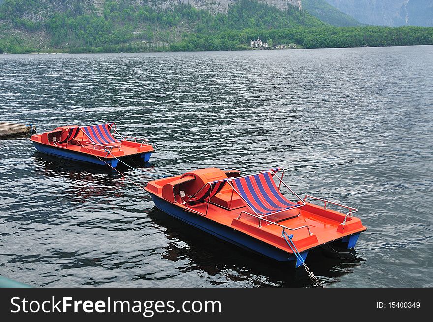 Red pontoon boats in the water near Salzburg. Red pontoon boats in the water near Salzburg