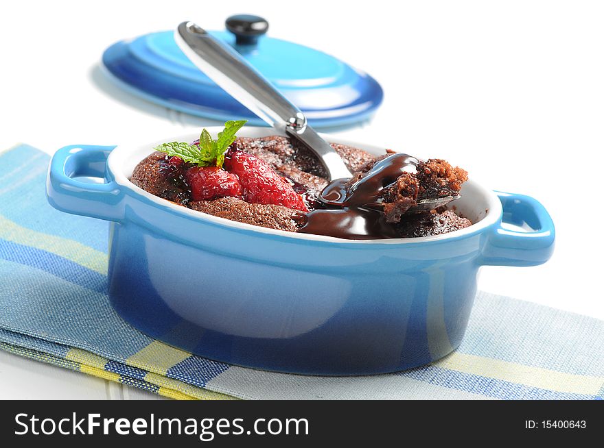 Molten lava cake with reduced strawberry sauce.