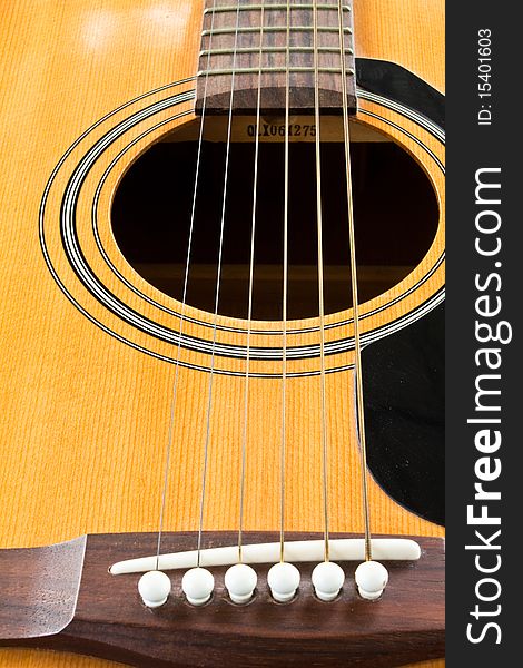 A closeup of an abstract classical acoustic guitar with strings