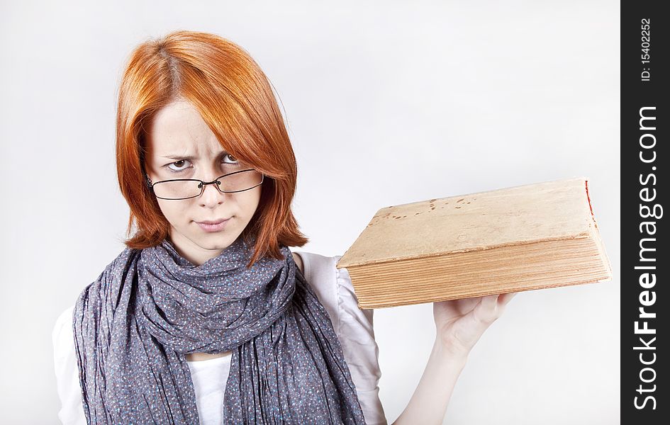 Young fashion girl in glasses with age book. Young fashion girl in glasses with age book.