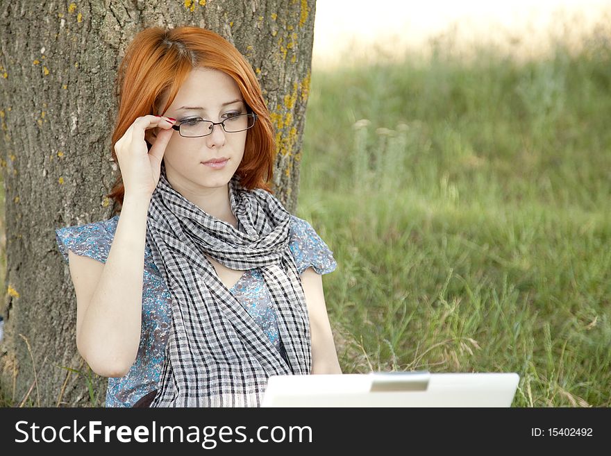 Young Girl In Glasses And Notebook