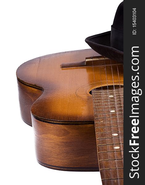 Isolated classical guitar and hat