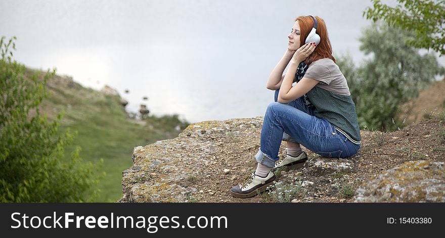 Young Girl With Headphones At Rock