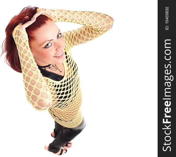 Young beautiful fashion model with red hair and a fishnet shirt. Young beautiful fashion model with red hair and a fishnet shirt.