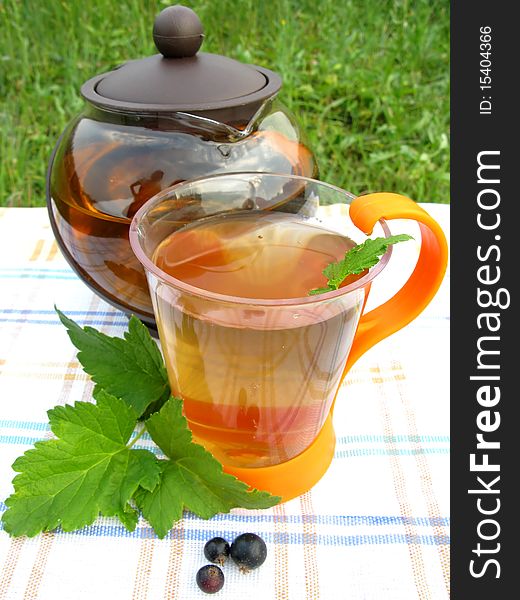 Fruit tea with currant extract outdoors