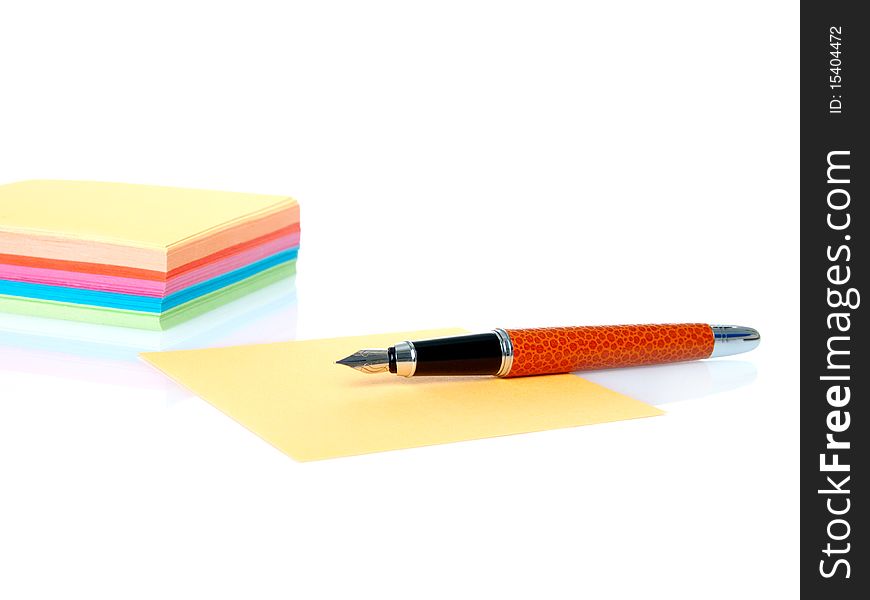 Colorful empty notes and pen isolated on a white background. Colorful empty notes and pen isolated on a white background