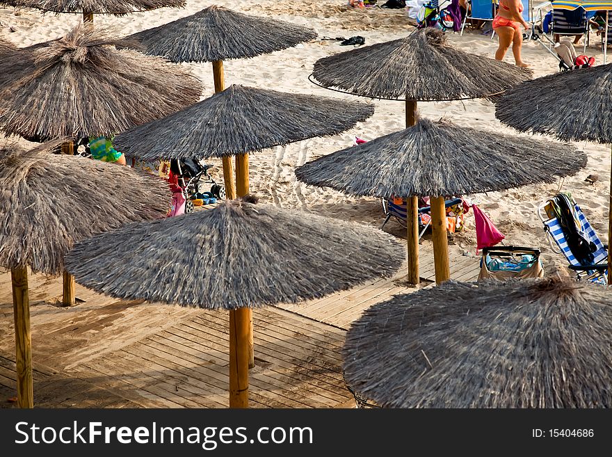 Sunshades at a crowded beach in Cadiz, Spain. Sunshades at a crowded beach in Cadiz, Spain