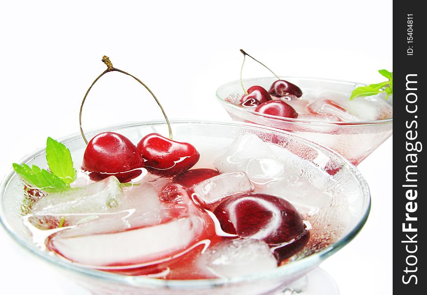 Alcohol green liqueur cocktail with ice and cherry. Alcohol green liqueur cocktail with ice and cherry