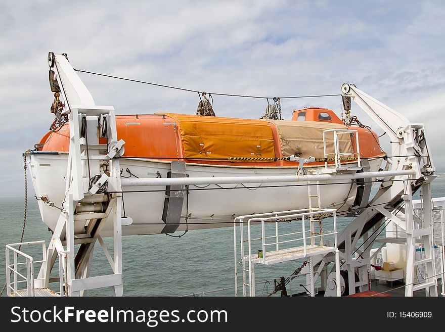 View of a lifeboat mounted on the side of a large passenger ferry