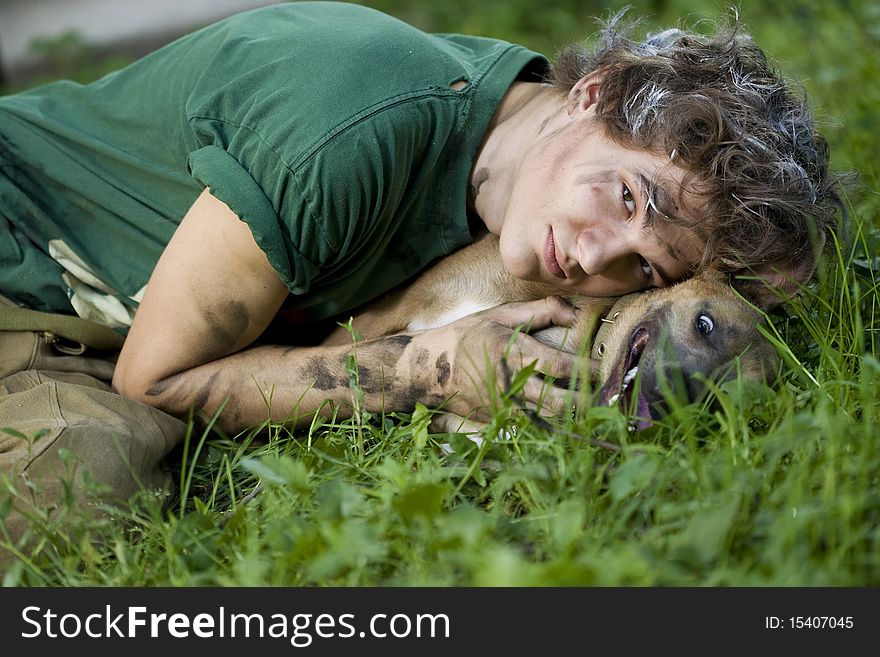 Portrait of a young man with his best friend - dog. Portrait of a young man with his best friend - dog