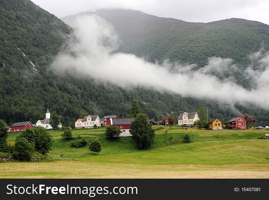 Low cloud hovers over the Norwegian village of Loen. Low cloud hovers over the Norwegian village of Loen