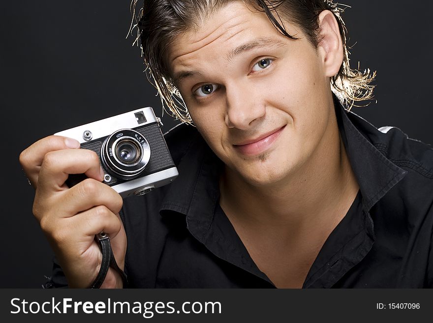 Man holding a photo camera. Man holding a photo camera