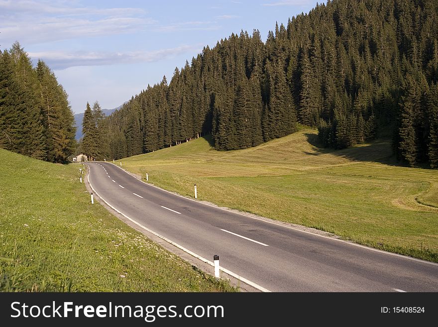 Mountain asphalt curve road on summer day in austria kaernten province