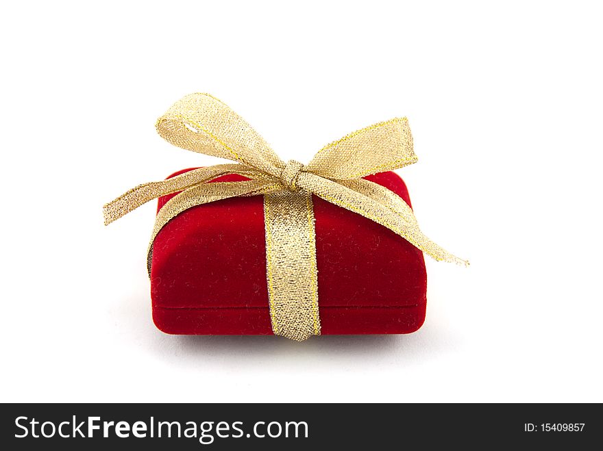 Studio shot of the red gift box with golden ribbon