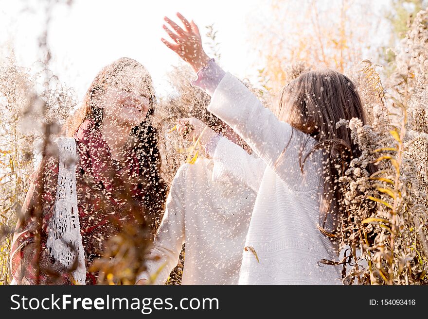 Photo of Happy family have fun among autumn dried flowers